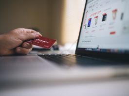 Person paying for online goods with credit card